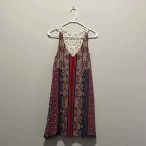 This Love Reign dress is a size small. Colorful printed racer back dress.